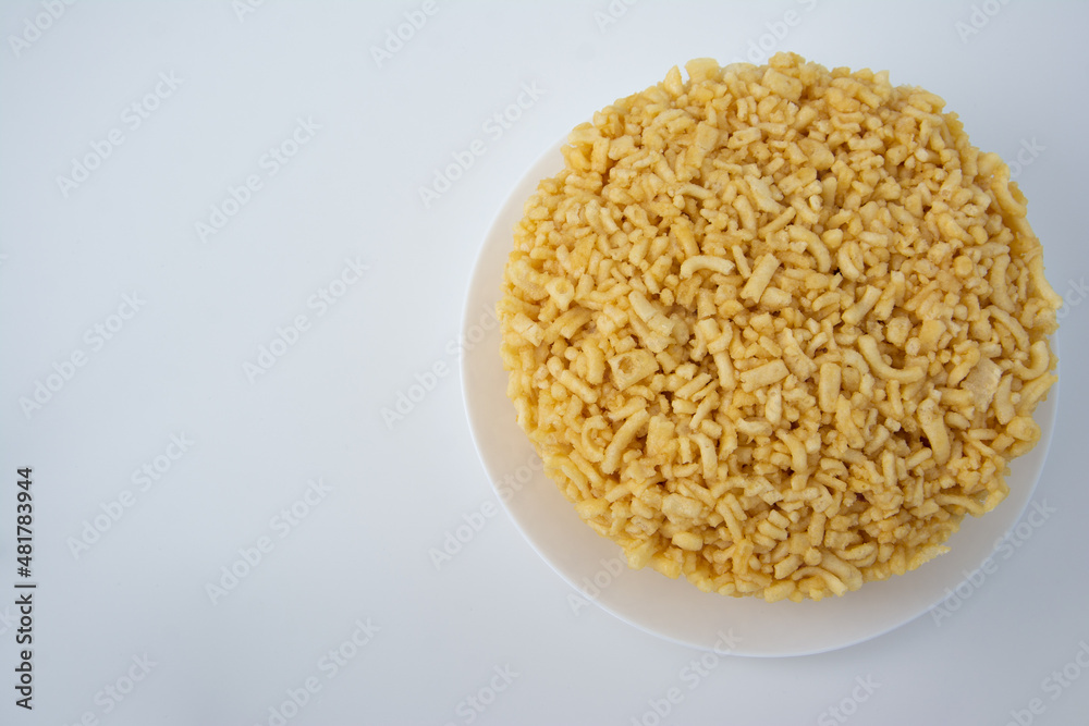 Traditional Tatar Cuisine Chak Chak. There is a Big Chack Chack on white plate and white Background. Copy space, top view Traditional Tatar Cuisine Chak Chak. There is a Big Chack Chack on white plate and white Background. Copy space, top view