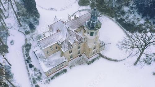 An aerial shot of Estate Old Groevenbeek during the snowfall. photo