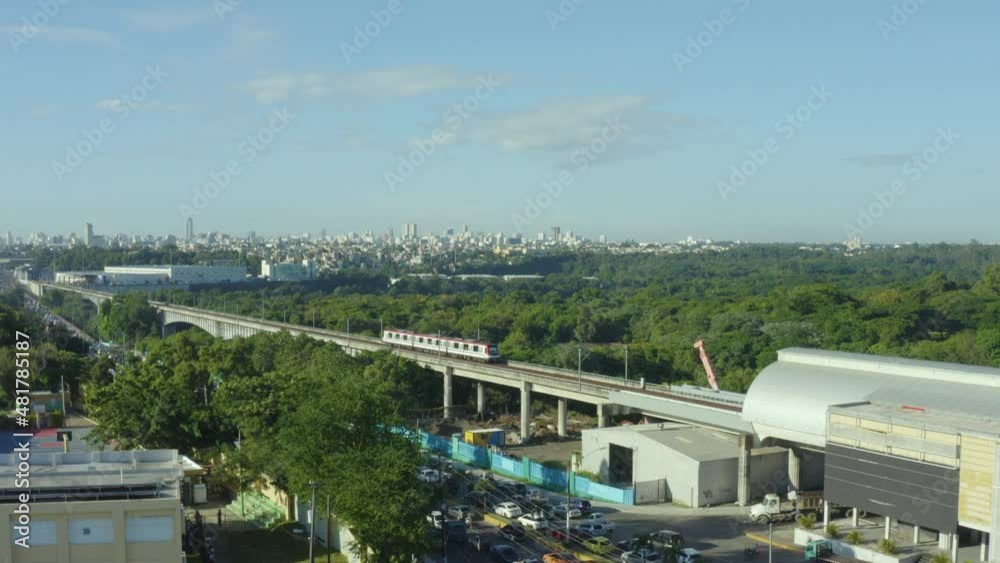 Aerial rising shot of metro leaving station, Santo Domingo in background Aerial rising shot of metro leaving station, Santo Domingo in background