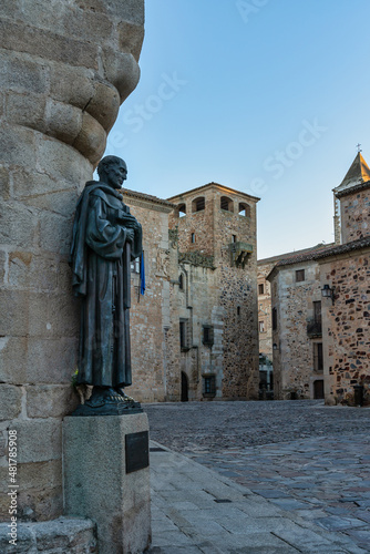 Medieval square in the center of the city of Caceres in Spain, with San Pedro de Alcantra statue. photo