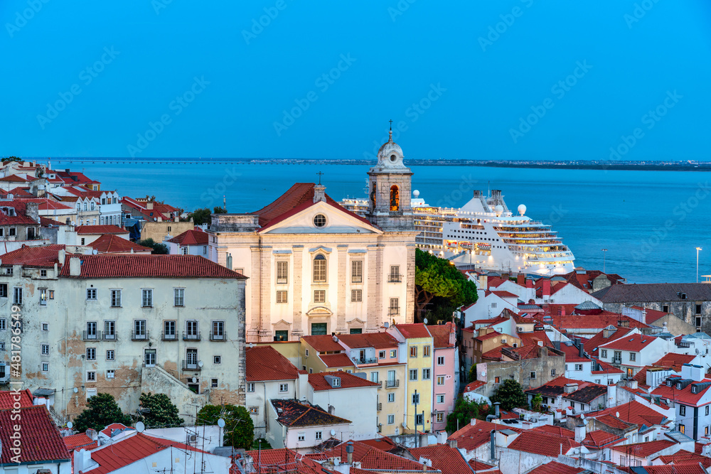 View of the typical Alfama neighborhood in Lisbon, Portugal - dome of the national pantheon.