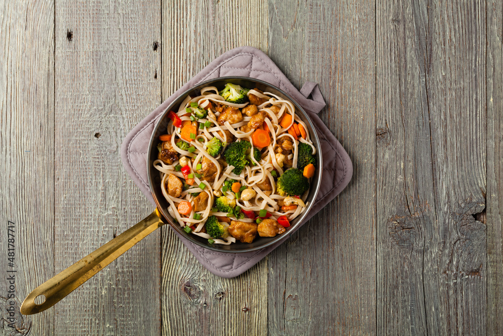 stir-fry pasta with chicken, broccoli and carrots. stir-fry pasta with chicken, broccoli and carrots.
