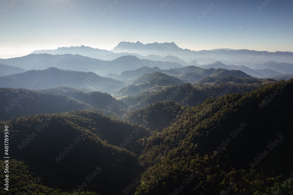 Scenery of Doi Luang Chiang Dao with mountain layer and fog on sunny day in tropical rainforest at national park