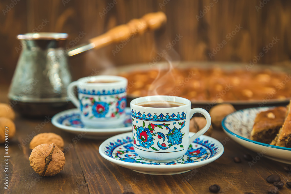 Fototapeta premium Baklava on the table and Turkish coffee. Selective focus.