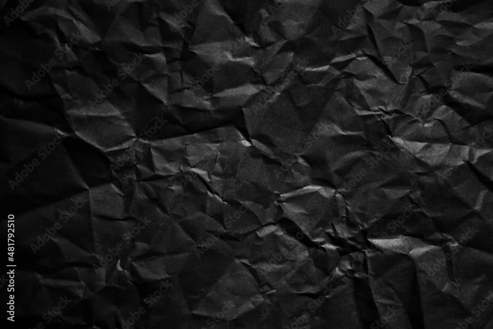 Textured crumpled black paper background. Textured crumpled black paper background.
