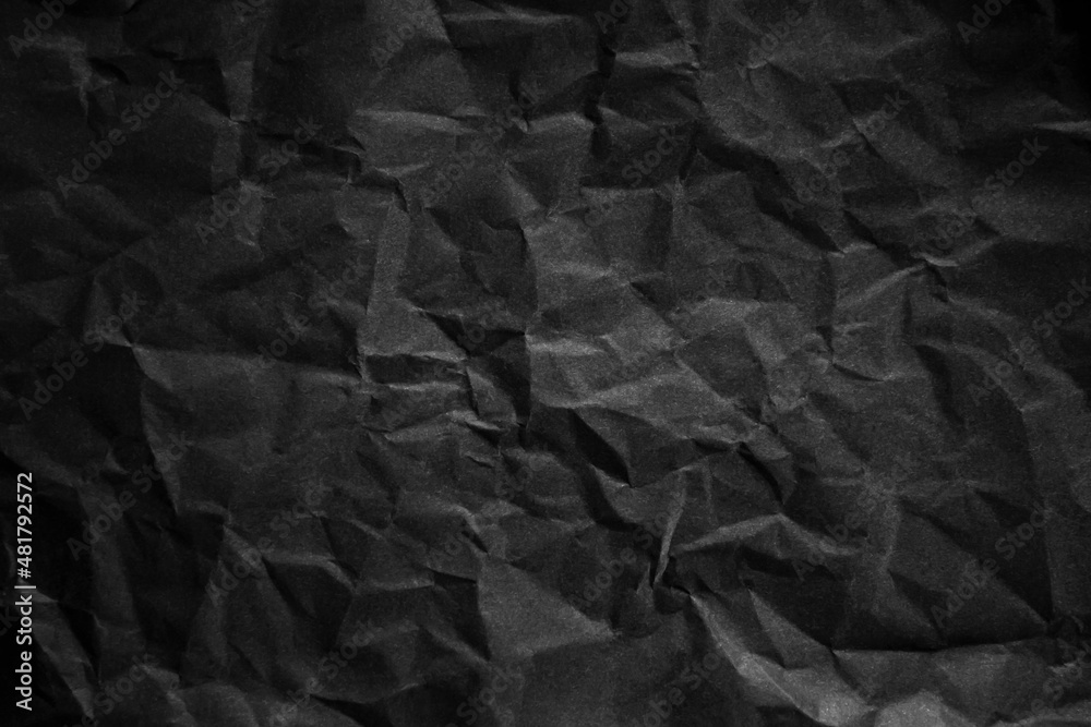 Textured crumpled black paper background. Textured crumpled black paper background.
