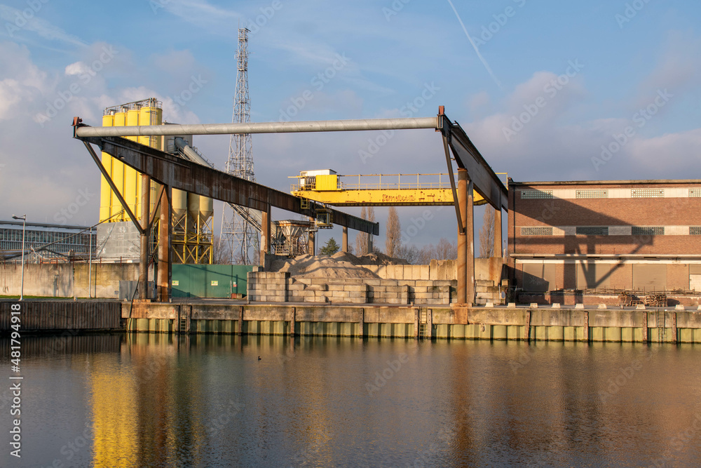 Old active shipping dock at a concrete production site in Malines, Belgium