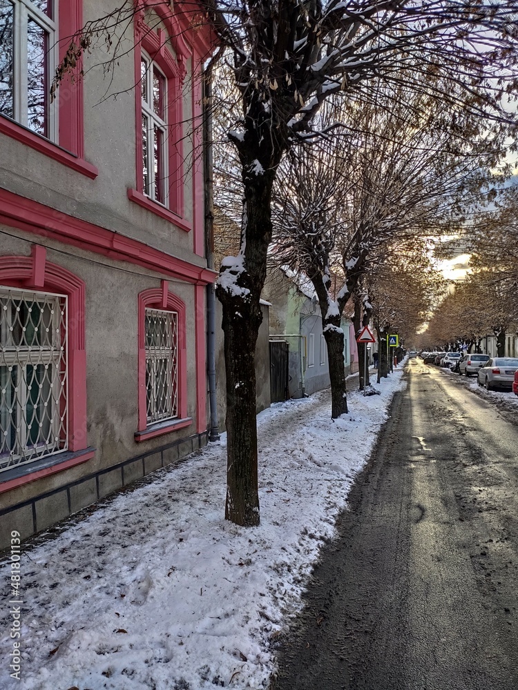 BISTRITA, Romania , january  2022 Sunset on Gheorghe Cosbuc Street 
