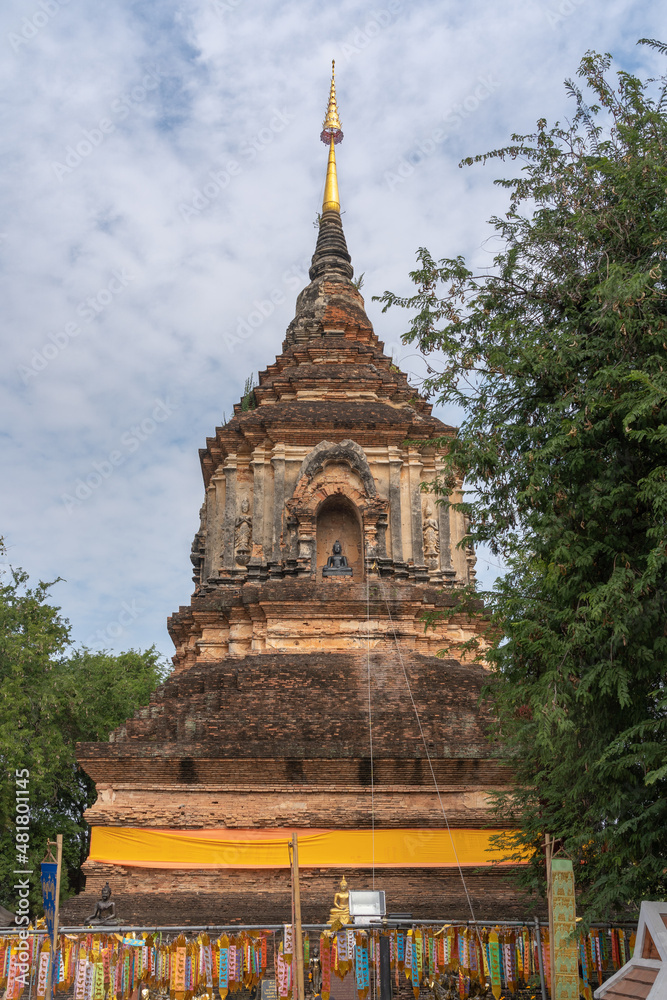 Landscape view of ancient brick and stucco stupa or chedi at landmark heritage Lanna style Wat Lok Moli or Lok Molee buddhist temple, Chiang Mai, Thailand