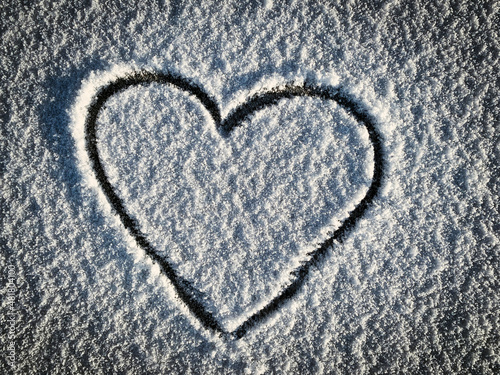 Heart shape on fresh snow  romantic winter mood for valentine  space for text  
