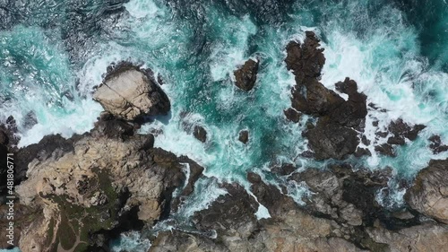 Ocean Waves Crashing Against Rocky Coast Of Big Sur In Monterey, California. - aerial