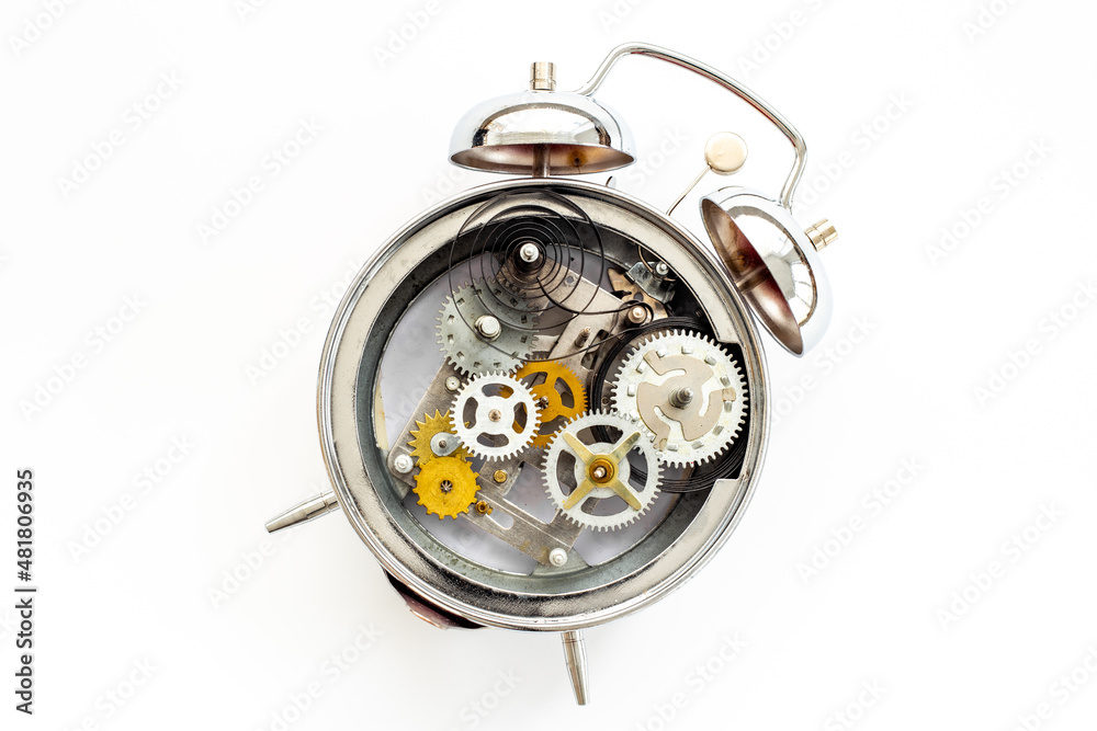 Fototapeta premium Watch mechanism with gears and wheels close up. Alarm clock mechanism