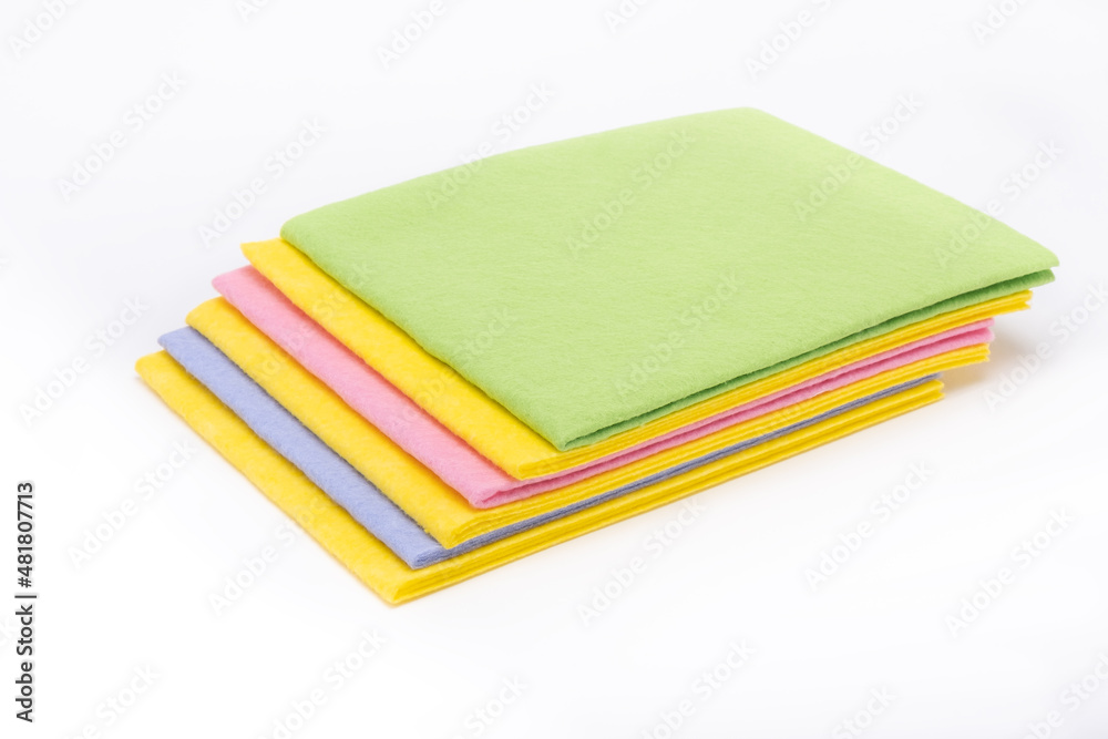 Fototapeta premium Multicolored cleaning napkins on white background