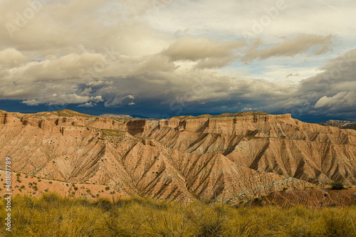 Ridges and cliffs of the Badland de los Coloraos in the Geopark of Granada photo