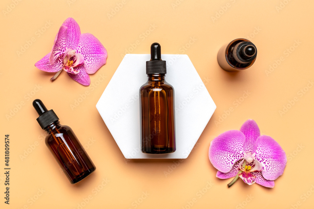 glass cosmetic bottle with moisturizing natural oil, Orchid lie on white podium isolated on beige background Top view Flat lay Eco, bio, zero waste product concept Copy space Mock up glass cosmetic bottle with moisturizing natural oil, Orchid lie on white podium isolated on beige background Top view Flat lay Eco, bio, zero waste product concept Copy space Mock up