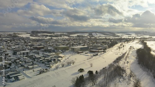Aerial Snow Covered Town Of Okoppe In Hokkaido. Dolly Forward. Establishing Shot photo