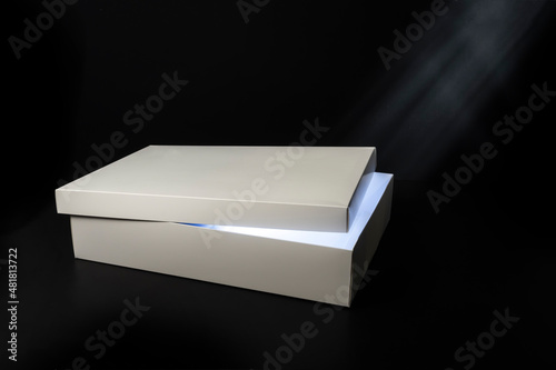 white box with light on black background