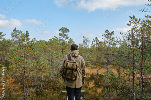 Man in the forest and enjoying nature. Beautiful natural landscape in the forest. Walk along the tourist trail. Outdoor adventure. Travel and exploration. Healthy lifestyle, active rest © Iuliia Pilipeichenko