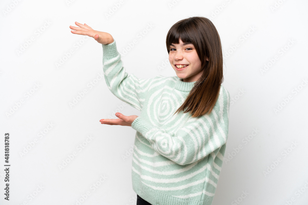 Little caucasian girl isolated on white background holding copyspace to insert an ad Little caucasian girl isolated on white background holding copyspace to insert an ad