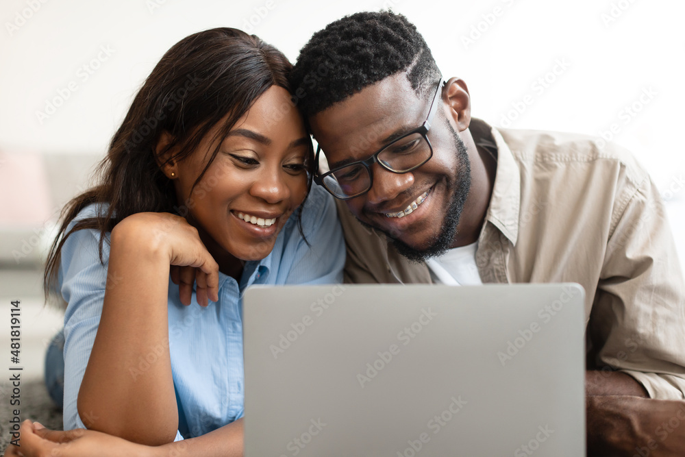 Portrait of African American couple using personal computer