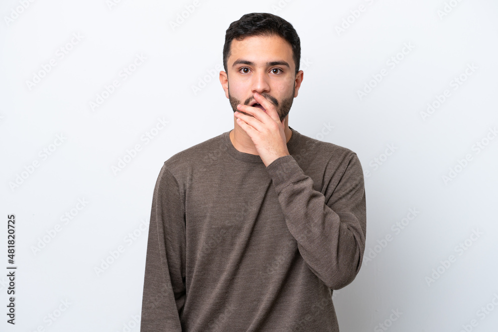 Young Brazilian man isolated on white background surprised and shocked while looking right