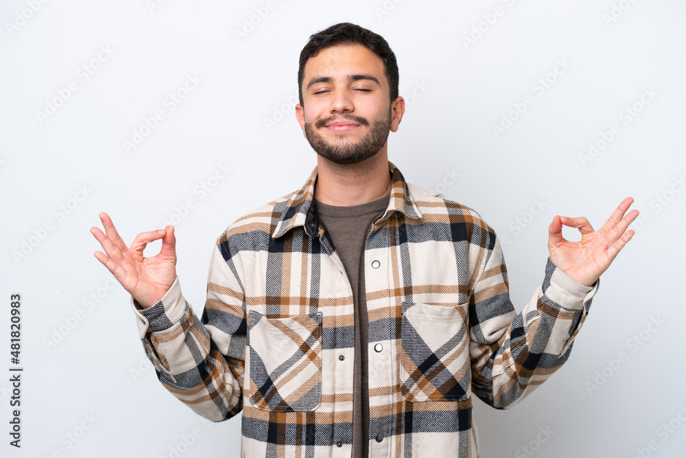 Young Brazilian man isolated on white background in zen pose