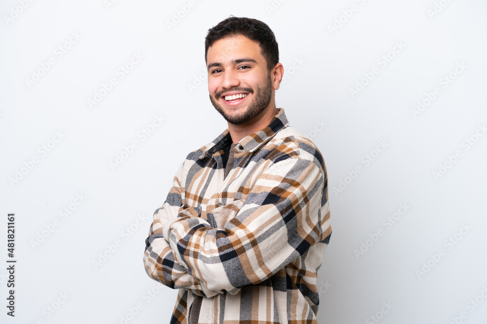 Young Brazilian man isolated on white background with arms crossed and looking forward Young Brazilian man isolated on white background with arms crossed and looking forward