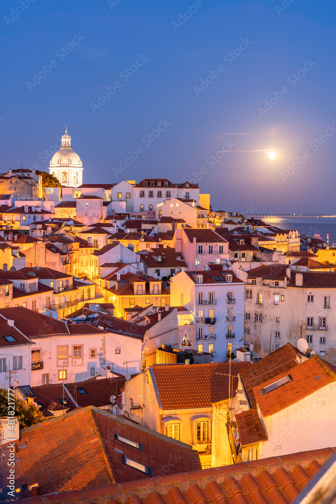View of the typical Alfama neighborhood in Lisbon, Portugal - dome of the national pantheon.