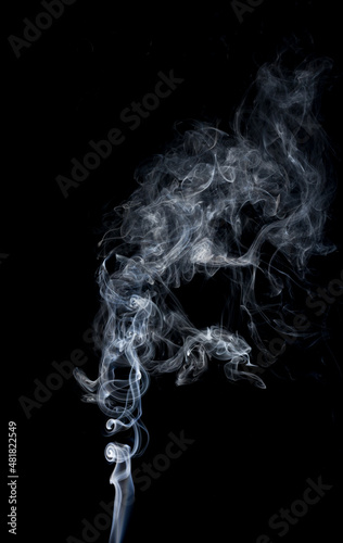 Close-up of clouds of smoke on black background.
