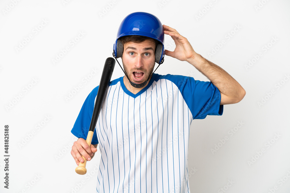 Young caucasian man playing baseball isolated on white background with surprise expression