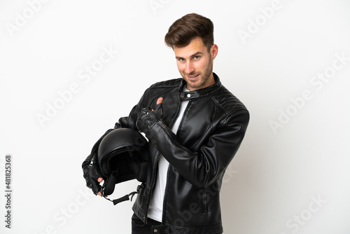 Young caucasian man with a motorcycle helmet isolated on white background giving a thumbs up gesture