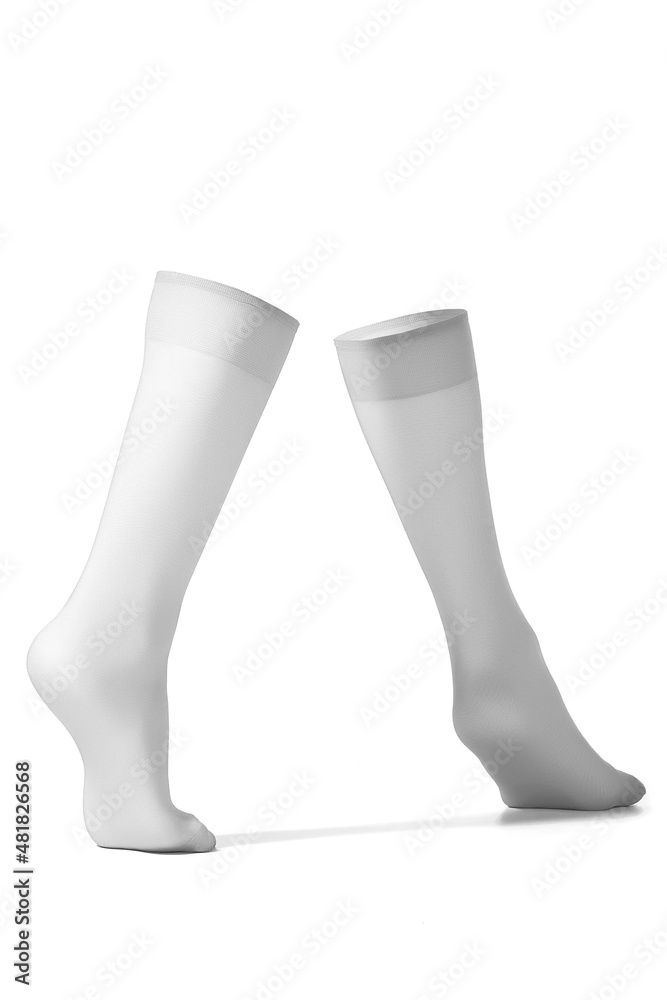 Detailed shot of white women socks with a wide rubber band. The nylon translucent golfs are shaped as walking woman's legs. The black women knee socks are isolated on a white background. Detailed shot of white women socks with a wide rubber band. The nylon translucent golfs are shaped as walking woman's legs. The black women knee socks are isolated on a white background.