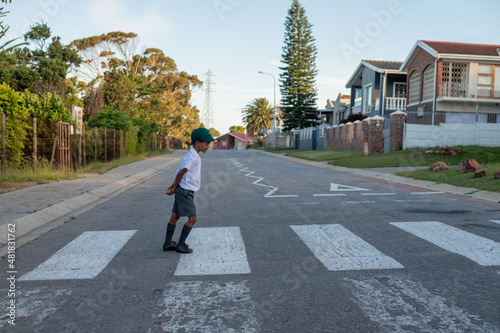 Wallpaper Mural Young boy seen walking across pedestrian crossing Torontodigital.ca