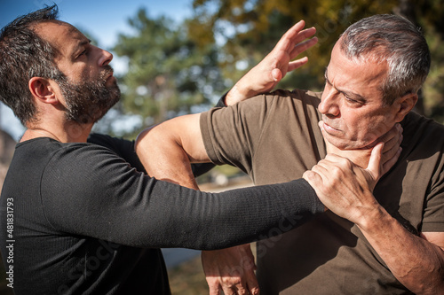 Street fighting self defense technique against holds and grabs
