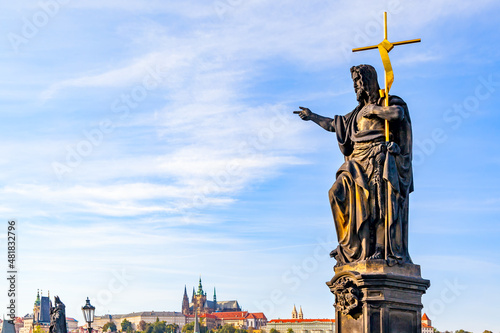 Foto John the Baptist on Charles Bridge and skyline of Prague