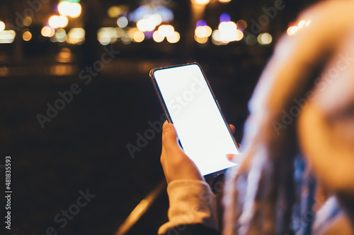 Close-up woman's hand holding modern smartphone