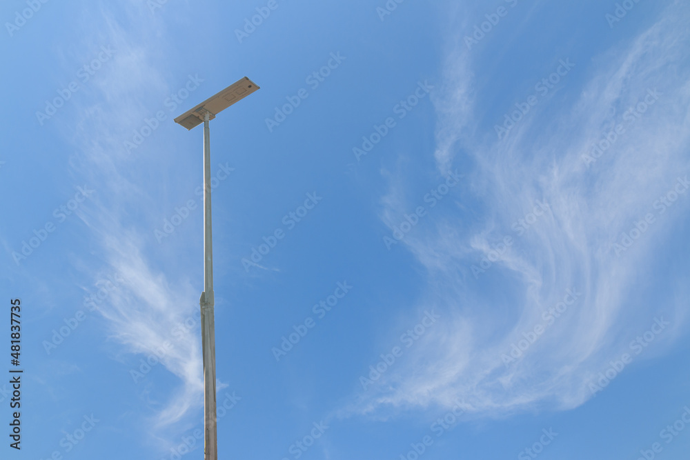 Solar cell street lamp pole with thin white clouds sky background Solar cell street lamp pole with thin white clouds sky background