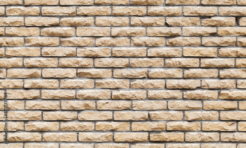Seamless background texture of decorative yellow brick wall