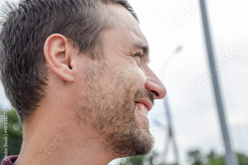 Face profile of a bearded man. unshaven face Beard on the face of a young man.