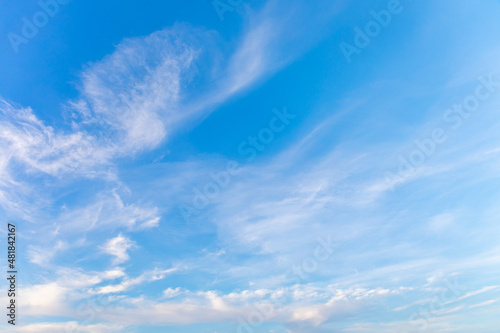 Blue sky with small white clouds for background usage.