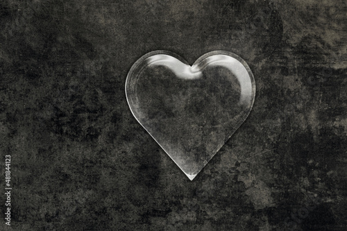 sign of a heart in transparent ice or a drop of water, on a dark background - dark love wallpaper