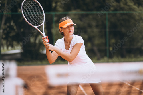 Fotografie Young woman tennis player at the court