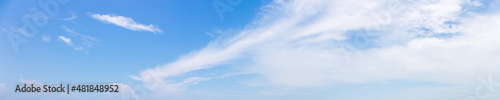 Panorama or panoramic photo of blue sky and white clouds or cloudscape.