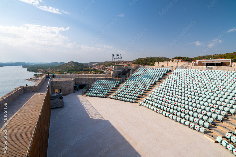 Stage inside of Michael's Fortress in Sibenik, Croatia. Red dots on seats are measures against the COVID disease.