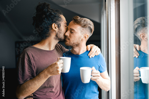 Fotografie Couple of gay men drinking coffee at home, morning ritual of same sex lovers, ga