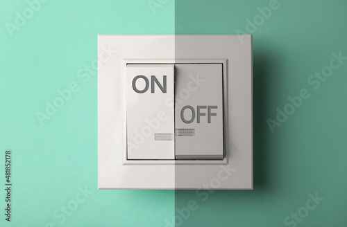 Turned ON and OFF light switch on turquoise background