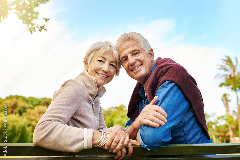 Brighter days are here. Portrait of a happy senior couple sitting on a park bench. Brighter days are here. Portrait of a happy senior couple sitting on a park bench.