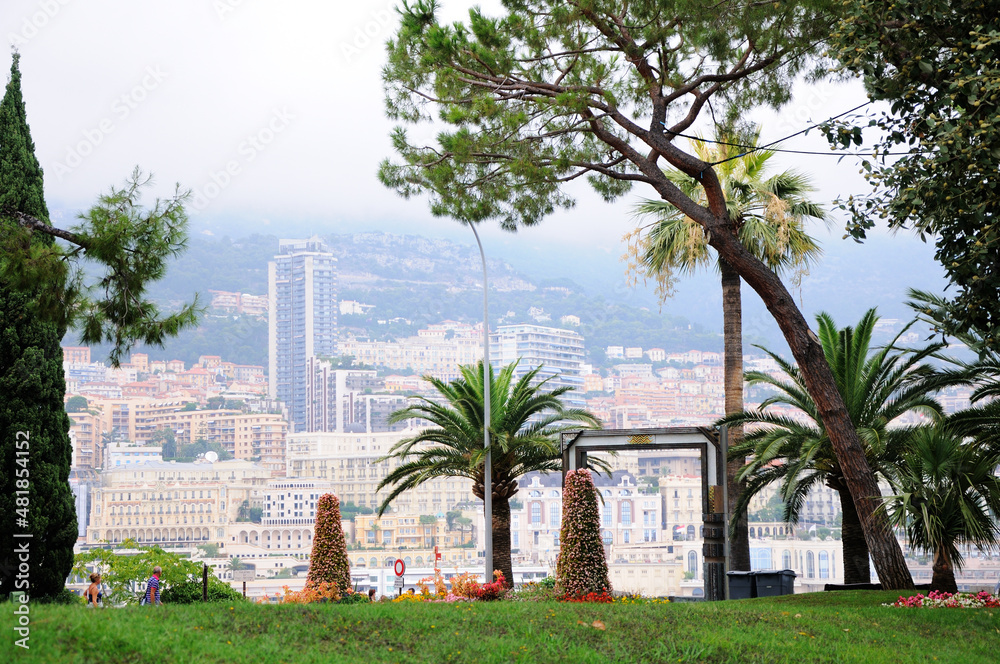 Obraz na płótnie Jardin des Pêcheurs. Park in Monaco-Ville. Modern buildings on the shore of the Port Hercules in the background. Monaco. w salonie