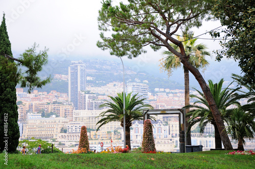 Jardin des Pêcheurs. Park in Monaco-Ville. Modern buildings on the shore of the Port Hercules in the background. Monaco.