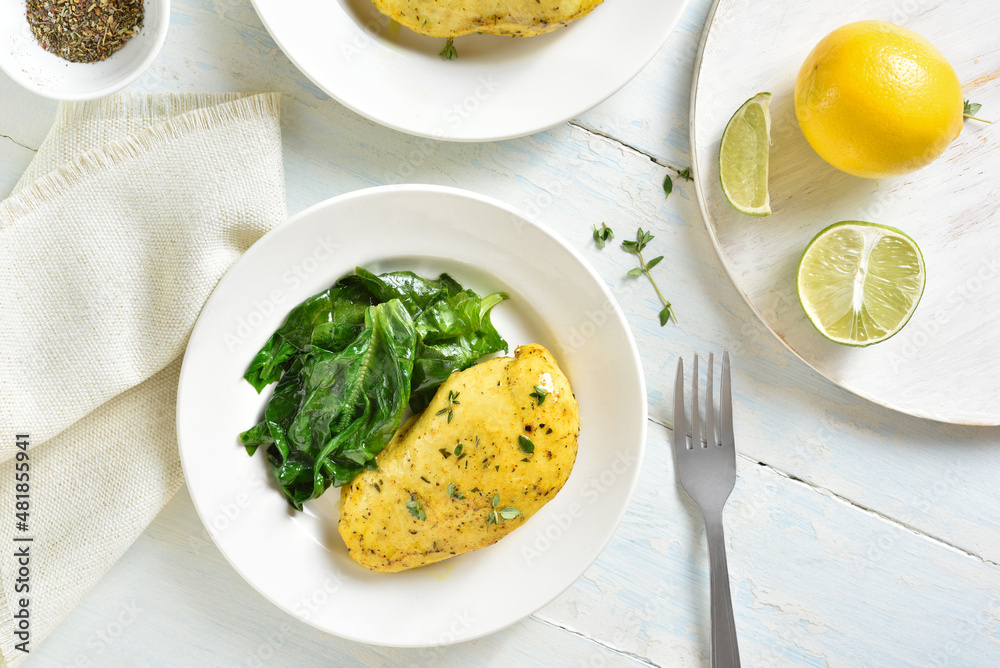 Baked turmeric chicken breast and sauteed spinach